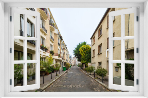 Fototapeta Naklejka Na Ścianę Okno 3D - Paris, France - November 15th 2021: Quiet housing area without parked cars on the residential street.