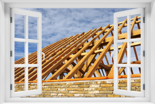 Fototapeta Naklejka Na Ścianę Okno 3D - close-up of a wooden roof frame for stable