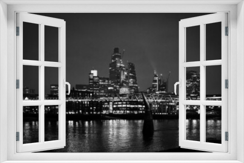 Fototapeta Naklejka Na Ścianę Okno 3D - Black and White night shot of City of London Skyline with Millenium Bridge in January 2022