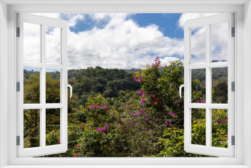 Fototapeta Naklejka Na Ścianę Okno 3D - View over the treetops with cloudy skies in the rainforest of Costa Rica