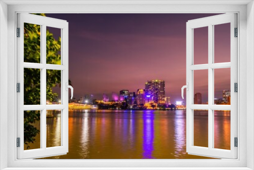Fototapeta Naklejka Na Ścianę Okno 3D - Enjoy the Nha Rong wharf and Ben Nghe canal afternoon in Ho Chi Minh City (Saigon). Colorful Saigon river at night.