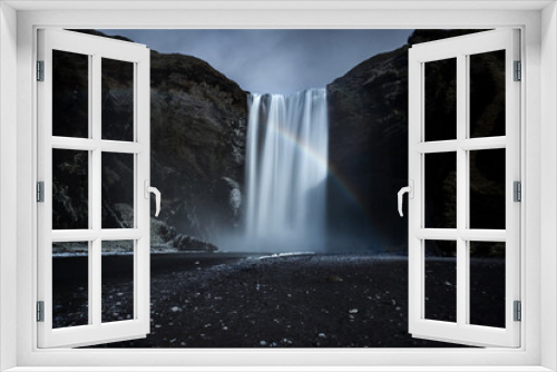 Fototapeta Naklejka Na Ścianę Okno 3D - The majestic Skogafoss waterfall and a rainbow in Iceland