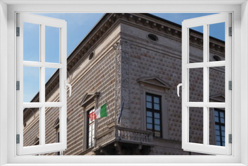 Fototapeta Naklejka Na Ścianę Okno 3D - Ferrara, Italy. Palazzo dei diamanti, one of the most famous monuments of the Italian Renaissance. Balcony with Italian flag.