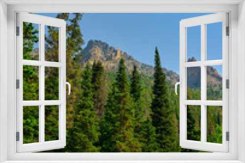 Fototapeta Naklejka Na Ścianę Okno 3D - Pine trees and granite and limestone mountain peaks in a vertical image