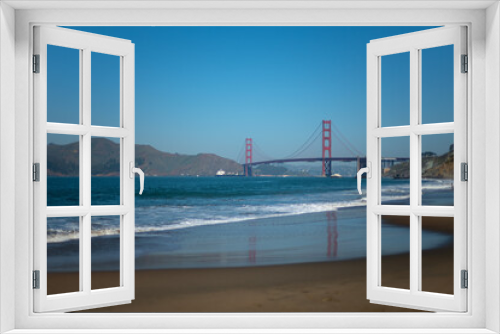 Fototapeta Naklejka Na Ścianę Okno 3D - Golden gate bridge view from Baker's beach with reflection and waves blue ocean blue sly in San Francisco