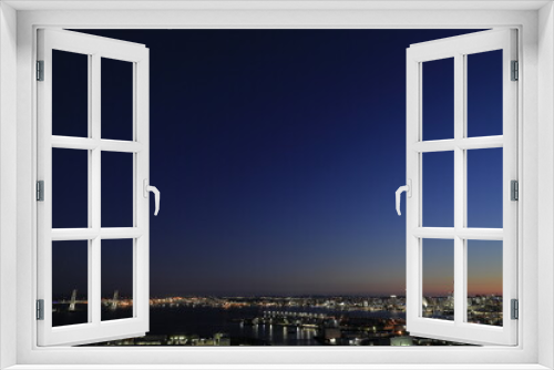 Fototapeta Naklejka Na Ścianę Okno 3D - 新子安から見た横浜みなとみらい21と横浜ベイブリッジ (夜景)
