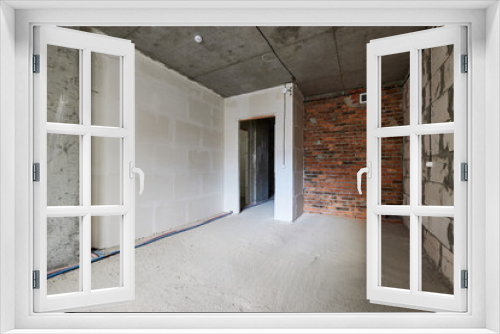 Fototapeta Naklejka Na Ścianę Okno 3D - new apartment in rough finish. Brick wall. Housing stock concept. Real estate object