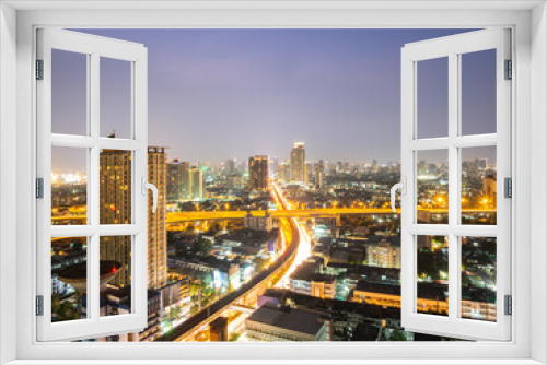 Fototapeta Naklejka Na Ścianę Okno 3D - High angle view of Bangkok, an urban area with sky train tracks