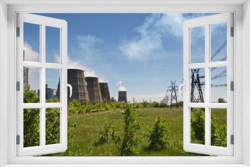 Fototapeta Naklejka Na Ścianę Okno 3D - Pavlodar, Kazakhstan - 05.29.2015 : Cooling towers and pipes of various compartments of a large thermal power plant