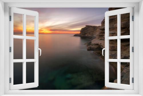 Fototapeta Naklejka Na Ścianę Okno 3D - Punta Galera sunset with red sky , Ibiza
