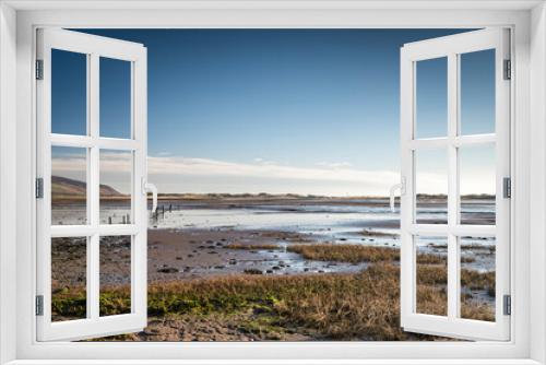 Fototapeta Naklejka Na Ścianę Okno 3D - A peaceful, sunny, winter full frame HDR landscape image of Saltcoats bay at low tide near Ravenglass, Cumbria, England