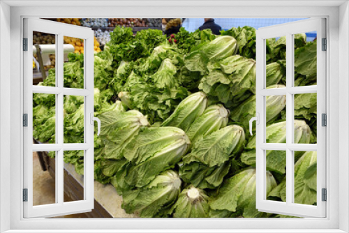 Fototapeta Naklejka Na Ścianę Okno 3D - large lettuces for sale at the grocery store, fresh lettuces great for salads,