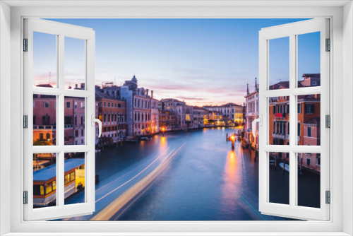 Fototapeta Naklejka Na Ścianę Okno 3D - Filtred scenery landscape with lights on water of Grand Canal during evening time for romantic sightseeing in Venezia, overview of ancient architecture buildings during international vacations