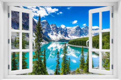 Fototapeta Naklejka Na Ścianę Okno 3D - Famous Moraine lake in Banff National Park, Canadian Rockies, Canada. Sunny summer day with amazing blue sky. Majestic mountains in the background. Clear turquoise blue water.