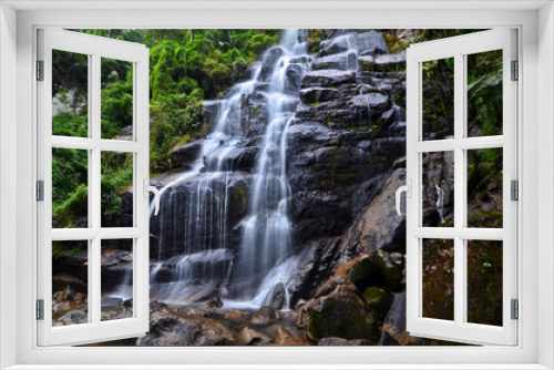 Fototapeta Naklejka Na Ścianę Okno 3D - Véu da Noiva (Bridal Veil) waterfall surrounded by the lush subtropical montane rainforest of the lower sector of Itatiaia National Park, Itatiaia, Rio de Janeiro, Brazil