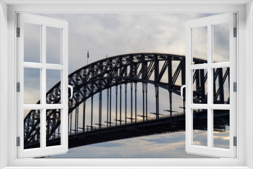 Fototapeta Naklejka Na Ścianę Okno 3D - Close-up view of Sydney Harbour Bridge with cloudy sky.