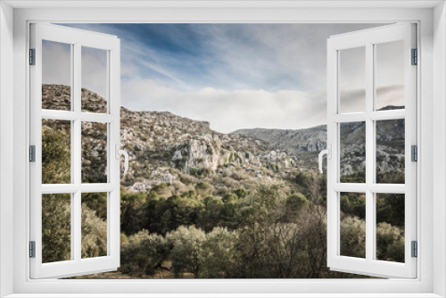 Fototapeta Naklejka Na Ścianę Okno 3D - Scenic landscape of limestone formations at Sierra de Camarolos, Hondonero, Andalusia, Southern Spain