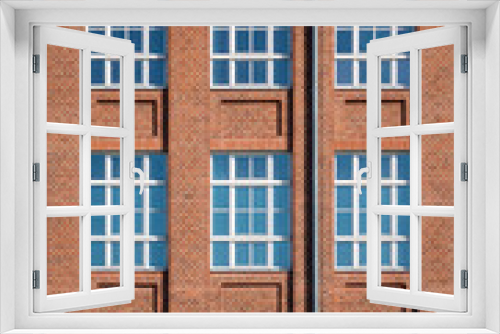 Fototapeta Naklejka Na Ścianę Okno 3D - Facade from an tall old brick building 