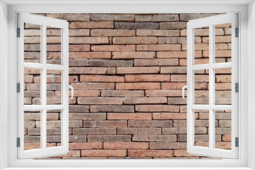 Fototapeta Naklejka Na Ścianę Okno 3D - Brick wall background is a wall made of clay bricks, giving the structure strength and cement line between bricks that looks beautiful. It is popular to build a wall of ancient monuments.copy space,