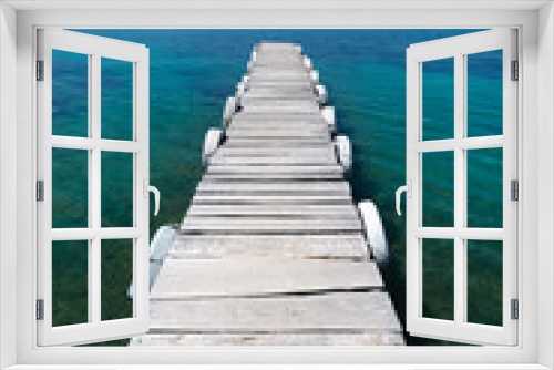 Fototapeta Naklejka Na Ścianę Okno 3D - Beautiful white old wooden pier on the seashore on a beautiful sunny day. Corfu Greece