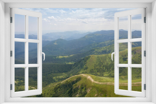 High mountains of the Ukrainian Carpathians in cloudy weather. Aerial drone view.