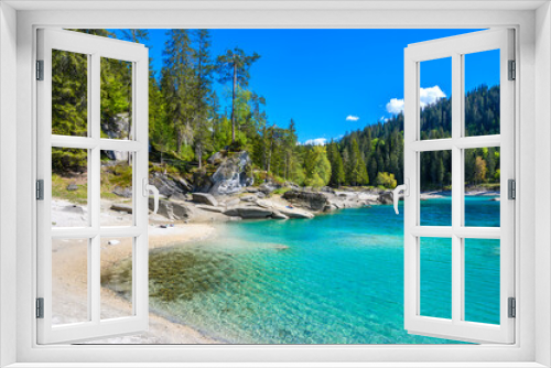 Fototapeta Naklejka Na Ścianę Okno 3D - Paradise beach in bay of Cauma Lake (Caumasee) with crystal blue water in beautiful mountain landscape scenery at Flims, Graubuenden - Switzerland