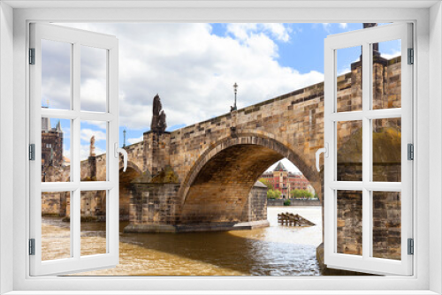 Charles Bridge on Vltava river in sunny day, Prague, Czech Republic