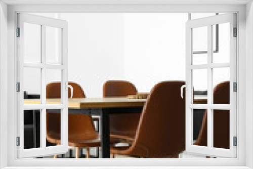 Interior of light dining room with table and modern chairs