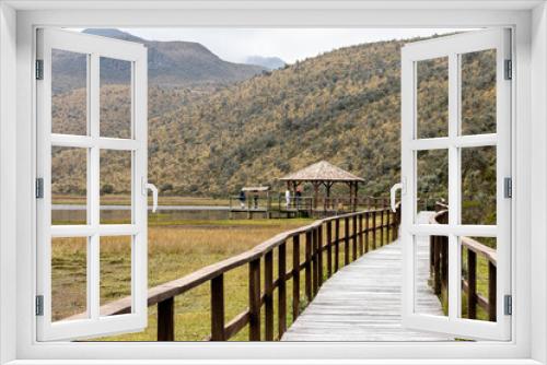 Fototapeta Naklejka Na Ścianę Okno 3D - Cotopaxi National Park. Observation deck and wooden walkway at lake Limpiopungo on an overcast rainy day. Cotopaxi province, Ecuador