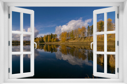 Fototapeta Naklejka Na Ścianę Okno 3D - colorful autumn panoramas with yellow trees by the lake, beautiful and colorful reflections of trees and clouds in the calm lake water