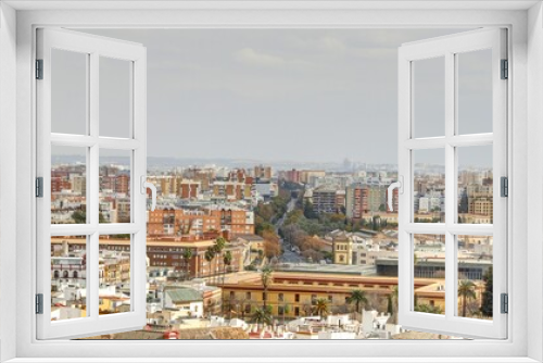 Fototapeta Naklejka Na Ścianę Okno 3D - la ville de Séville vue depuis les hauteurs de la cathédrale avec ses toits, ses rues et ses églises