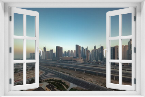 Fototapeta Naklejka Na Ścianę Okno 3D - Dubai Marina skyscrapers and Sheikh Zayed road with metro railway aerial timelapse, United Arab Emirates