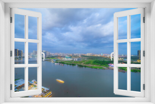 Fototapeta Naklejka Na Ścianę Okno 3D - Aerial view of Bitexco Tower, buildings, roads, Thu Thiem 2 bridge and Saigon river in Ho Chi Minh city - Far away is Landmark 81 skyscrapper. This city is a popular tourist destination of Vietnam