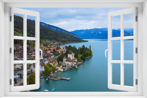 Fototapeta Naklejka Na Ścianę Okno 3D - Famous Castle Oberhofen at Lake Thun in Switzerland - drone footage