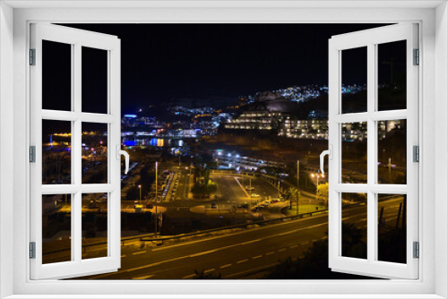 Fototapeta Naklejka Na Ścianę Okno 3D - Beautiful night view of holiday resort town Puerto Rico de Gran Canaria, Canary Islands, Spain on the Atlantic coast with illuminated street and hotel.