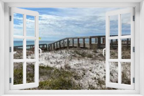 Fototapeta Naklejka Na Ścianę Okno 3D - Upper view of dunes and walkway at Henderson Beach State Park Florida 