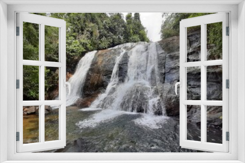Fototapeta Naklejka Na Ścianę Okno 3D - The waterfall in the middle of the forest / RATHNAPURA,SRILANKA