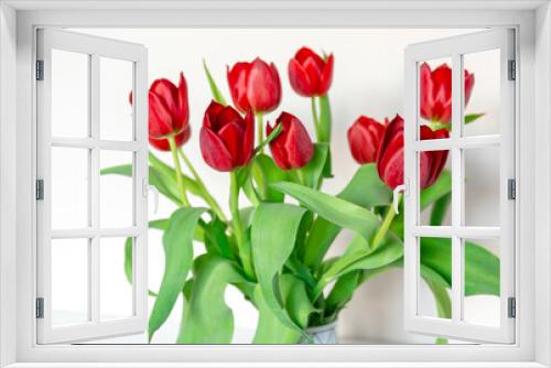 Fototapeta Naklejka Na Ścianę Okno 3D - Red tulips in a vase on the shelf at home. Bouquet for Mothers day, home decoration