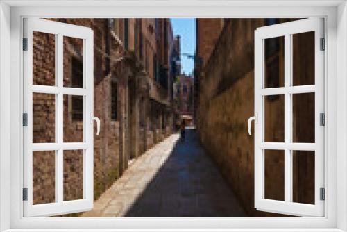 Fototapeta Naklejka Na Ścianę Okno 3D - VENICE, ITALY - August 27, 2021: View of narrow and historic alley in the center of Venice