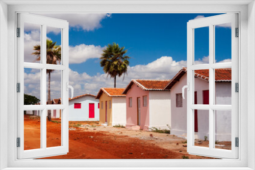 Fototapeta Naklejka Na Ścianę Okno 3D - minha casa minha vida - casas em conjunto residencial construído em terreno de barro vermelho