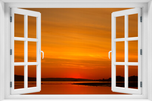 Fototapeta Naklejka Na Ścianę Okno 3D - bright orange sunset over the sea