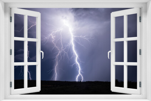 Fototapeta Naklejka Na Ścianę Okno 3D - Powerful lightning bolt strikes in a storm