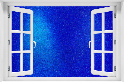 Fototapeta Naklejka Na Ścianę Okno 3D - On a blue background, a light blue wide vertical beam of light