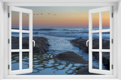 Fototapeta Naklejka Na Ścianę Okno 3D - california seashore at dusk with tidepools and pelicans in flight