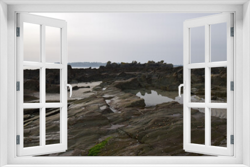 Fototapeta Naklejka Na Ścianę Okno 3D - Rough, rocky coast of Brittany, France, with reflections in the water