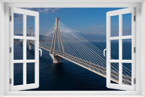 Fototapeta Naklejka Na Ścianę Okno 3D - Huge suspension bridge with four large pillars over sea strait, Rio-Antirrio, Peloponnese, Greece
