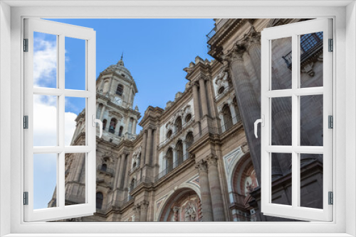 Detailed view at the front facade at the Malaga Cathedral or Santa Iglesia Catedral Basílica de la Encarnación, and Obispo square