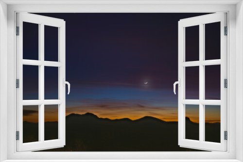 Fototapeta Naklejka Na Ścianę Okno 3D - Moon over the mountains at twilight