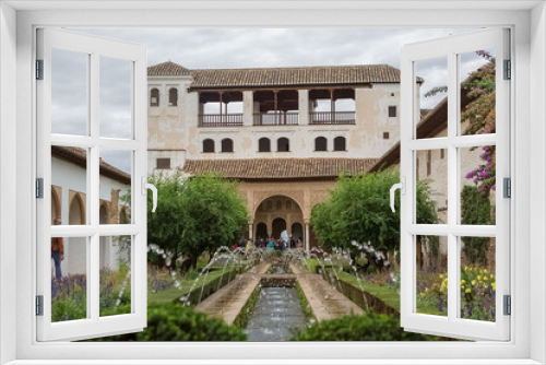 Fototapeta Naklejka Na Ścianę Okno 3D - Exterior view at the Garden Water Channel, or Patio de la Acequia, on Generalife Gardens, inside at the Alhambra citadel, alcazaba, Granada, Andalusia, Spain