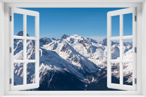 Fototapeta Naklejka Na Ścianę Okno 3D - Panoramic view of winter snowy mountains in Caucasus region in Russia with blue sky